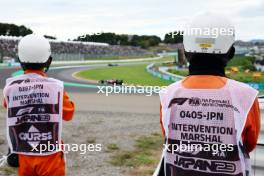 Circuit atmosphere - marshals trackside. 22.09.2023. Formula 1 World Championship, Rd 17, Japanese Grand Prix, Suzuka, Japan, Practice Day.