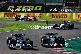 (L to R): George Russell (GBR) Mercedes AMG F1 W14 and team mate Lewis Hamilton (GBR) Mercedes AMG F1 W14 battle for position. 24.09.2023. Formula 1 World Championship, Rd 17, Japanese Grand Prix, Suzuka, Japan, Race Day.