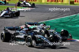 (L to R): George Russell (GBR) Mercedes AMG F1 W14 and team mate Lewis Hamilton (GBR) Mercedes AMG F1 W14 battle for position. 24.09.2023. Formula 1 World Championship, Rd 17, Japanese Grand Prix, Suzuka, Japan, Race Day.