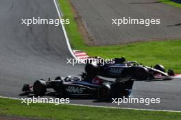 Kevin Magnussen (DEN) Haas VF-23 is passed by team mate Nico Hulkenberg (GER) Haas VF-23 after he was hit in the race. 24.09.2023. Formula 1 World Championship, Rd 17, Japanese Grand Prix, Suzuka, Japan, Race Day.