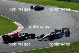 Sergio Perez (MEX) Red Bull Racing RB19 hits Kevin Magnussen (DEN) Haas VF-23. 24.09.2023. Formula 1 World Championship, Rd 17, Japanese Grand Prix, Suzuka, Japan, Race Day.
