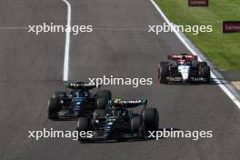 Lewis Hamilton (GBR) Mercedes AMG F1 W14 and team mate George Russell (GBR) Mercedes AMG F1 W14 battle for position. 24.09.2023. Formula 1 World Championship, Rd 17, Japanese Grand Prix, Suzuka, Japan, Race Day.