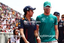 (L to R): Sergio Perez (MEX) Red Bull Racing with Lance Stroll (CDN) Aston Martin F1 Team on the drivers' parade. 24.09.2023. Formula 1 World Championship, Rd 17, Japanese Grand Prix, Suzuka, Japan, Race Day.