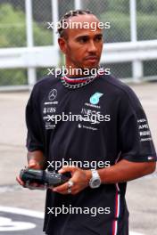Lewis Hamilton (GBR) Mercedes AMG F1 with radio controlled car. 21.09.2023. Formula 1 World Championship, Rd 17, Japanese Grand Prix, Suzuka, Japan, Preparation Day.