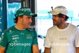 (L to R): Fernando Alonso (ESP) Aston Martin F1 Team with Sebastian Vettel (GER). 21.09.2023. Formula 1 World Championship, Rd 17, Japanese Grand Prix, Suzuka, Japan, Preparation Day.