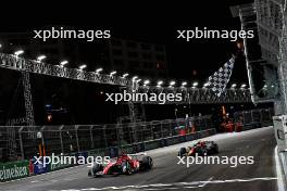 Charles Leclerc (MON) Ferrari SF-23 takes the chequered flag at the end of the race to finish second ahead of Sergio Perez (MEX) Red Bull Racing RB19. 18.11.2023. Formula 1 World Championship, Rd 22, Las Vegas Grand Prix, Las Vegas, Nevada, USA, Race Day.