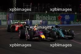 Sergio Perez (MEX) Red Bull Racing RB19 and Fernando Alonso (ESP) Aston Martin F1 Team AMR23 battle for position. 18.11.2023. Formula 1 World Championship, Rd 22, Las Vegas Grand Prix, Las Vegas, Nevada, USA, Race Day.