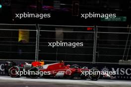 Carlos Sainz Jr (ESP) Ferrari SF-23 and Sergio Perez (MEX) Red Bull Racing RB19 battle for position. 18.11.2023. Formula 1 World Championship, Rd 22, Las Vegas Grand Prix, Las Vegas, Nevada, USA, Race Day.