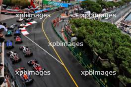 Sergio Perez (MEX) Red Bull Racing RB19 and Zhou Guanyu (CHN) Alfa Romeo F1 Team C43 at the start of the race. 28.05.2023. Formula 1 World Championship, Rd 7, Monaco Grand Prix, Monte Carlo, Monaco, Race Day.