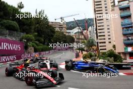 Zhou Guanyu (CHN) Alfa Romeo F1 Team C43 and Logan Sargeant (USA) Williams Racing FW45 at the start of the race. 28.05.2023. Formula 1 World Championship, Rd 7, Monaco Grand Prix, Monte Carlo, Monaco, Race Day.