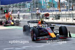 Sergio Perez (MEX) Red Bull Racing RB19 and Max Verstappen (NLD) Red Bull Racing RB19 in the pits. 05.05.2023. Formula 1 World Championship, Rd 5, Miami Grand Prix, Miami, Florida, USA, Practice Day.