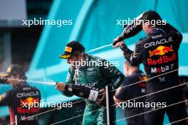 (L to R): Fernando Alonso (ESP) Aston Martin F1 Team celebrates his third position on the podium with race winner Max Verstappen (NLD) Red Bull Racing. 07.05.2023. Formula 1 World Championship, Rd 5, Miami Grand Prix, Miami, Florida, USA, Race Day.