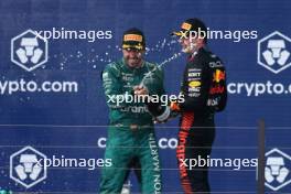 Fernando Alonso (ESP) Aston Martin F1 Team celebrates his third position on the podium with race winner Max Verstappen (NLD) Red Bull Racing. 07.05.2023. Formula 1 World Championship, Rd 5, Miami Grand Prix, Miami, Florida, USA, Race Day.