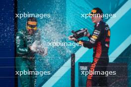 (L to R): Fernando Alonso (ESP) Aston Martin F1 Team celebrates his second position on the podium with race winner Max Verstappen (NLD) Red Bull Racing. 07.05.2023. Formula 1 World Championship, Rd 5, Miami Grand Prix, Miami, Florida, USA, Race Day.