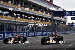 (L to R): Sergio Perez (MEX) Red Bull Racing RB19 and Max Verstappen (NLD) Red Bull Racing RB19 battle for the lead of the race. 07.05.2023. Formula 1 World Championship, Rd 5, Miami Grand Prix, Miami, Florida, USA, Race Day.
