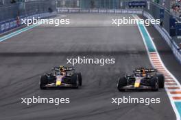 Max Verstappen (NLD) Red Bull Racing RB19 passes team mate Sergio Perez (MEX) Red Bull Racing RB19 to take the lead of the race. 07.05.2023. Formula 1 World Championship, Rd 5, Miami Grand Prix, Miami, Florida, USA, Race Day.