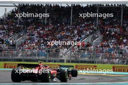 Fernando Alonso (ESP) Aston Martin F1 Team AMR23 leads Carlos Sainz Jr (ESP) Ferrari SF-23. 07.05.2023. Formula 1 World Championship, Rd 5, Miami Grand Prix, Miami, Florida, USA, Race Day.