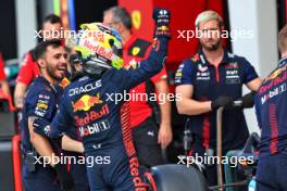 Sergio Perez (MEX) Red Bull Racing celebrates his pole position in qualifying parc ferme with the team. 06.05.2023. Formula 1 World Championship, Rd 5, Miami Grand Prix, Miami, Florida, USA, Qualifying Day.
