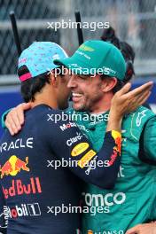 (L to R): Sergio Perez (MEX) Red Bull Racing celebrates his pole position in qualifying parc ferme with second placed Fernando Alonso (ESP) Aston Martin F1 Team. 06.05.2023. Formula 1 World Championship, Rd 5, Miami Grand Prix, Miami, Florida, USA, Qualifying Day.