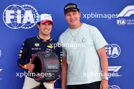Sergio Perez (MEX) Red Bull Racing is presented with the Pirelli Pole Position Award from Tiesto (NLD) DJ. 06.05.2023. Formula 1 World Championship, Rd 5, Miami Grand Prix, Miami, Florida, USA, Qualifying Day.