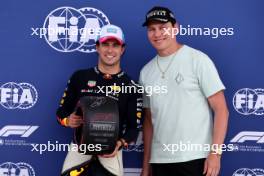 Sergio Perez (MEX) Red Bull Racing receives the Pirelli Pole Position Award from Tiesto (NLD) DJ. 06.05.2023. Formula 1 World Championship, Rd 5, Miami Grand Prix, Miami, Florida, USA, Qualifying Day.