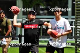 Valtteri Bottas (FIN) Alfa Romeo F1 Team plays American Football with team mate Zhou Guanyu (CHN) Alfa Romeo F1 Team. 04.05.2023. Formula 1 World Championship, Rd 5, Miami Grand Prix, Miami, Florida, USA, Preparation Day.