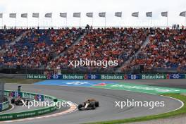 Lando Norris (GBR) McLaren MCL60 and Max Verstappen (NLD) Red Bull Racing RB19. 25.08.2023. Formula 1 World Championship, Rd 14, Dutch Grand Prix, Zandvoort, Netherlands, Practice Day.