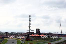 (L to R): Yuki Tsunoda (JPN) AlphaTauri AT04 and Esteban Ocon (FRA) Alpine F1 Team A523. 25.08.2023. Formula 1 World Championship, Rd 14, Dutch Grand Prix, Zandvoort, Netherlands, Practice Day.