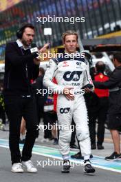 Liam Lawson (NZL) AlphaTauri with Chris Medland (GBR) Journalist on the grid. 27.08.2023. Formula 1 World Championship, Rd 14, Dutch Grand Prix, Zandvoort, Netherlands, Race Day.