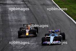 Pierre Gasly (FRA) Alpine F1 Team A523 and Max Verstappen (NLD) Red Bull Racing RB19 battle for position. 27.08.2023. Formula 1 World Championship, Rd 14, Dutch Grand Prix, Zandvoort, Netherlands, Race Day.