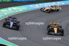 Alexander Albon (THA) Williams Racing FW45 and Lando Norris (GBR) McLaren MCL60 battle for position. 27.08.2023. Formula 1 World Championship, Rd 14, Dutch Grand Prix, Zandvoort, Netherlands, Race Day.