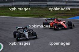 George Russell (GBR) Mercedes AMG F1 W14 and Charles Leclerc (MON) Ferrari SF-23 battle for position. 27.08.2023. Formula 1 World Championship, Rd 14, Dutch Grand Prix, Zandvoort, Netherlands, Race Day.