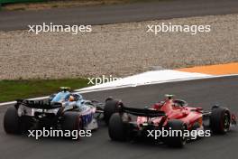 Carlos Sainz Jr (ESP) Ferrari SF-23 and Pierre Gasly (FRA) Alpine F1 Team A523 battle for position. 27.08.2023. Formula 1 World Championship, Rd 14, Dutch Grand Prix, Zandvoort, Netherlands, Race Day.