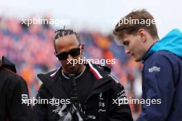 (L to R): Lewis Hamilton (GBR) Mercedes AMG F1 with Logan Sargeant (USA) Williams Racing on the drivers' parade. 27.08.2023. Formula 1 World Championship, Rd 14, Dutch Grand Prix, Zandvoort, Netherlands, Race Day.