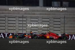 Carlos Sainz Jr (ESP) Ferrari SF-23 and Oscar Piastri (AUS) McLaren MCL60 battle for position. 07.10.2023. Formula 1 World Championship, Rd 18, Qatar Grand Prix, Doha, Qatar, Sprint Day.