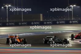 Oscar Piastri (AUS) McLaren MCL60 and George Russell (GBR) Mercedes AMG F1 W14 battle for position. 07.10.2023. Formula 1 World Championship, Rd 18, Qatar Grand Prix, Doha, Qatar, Sprint Day.