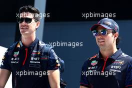 Sergio Perez (MEX) Red Bull Racing (Right) with Jo Canales, Red Bull Racing Personal Trainer. 17.03.2023. Formula 1 World Championship, Rd 2, Saudi Arabian Grand Prix, Jeddah, Saudi Arabia, Practice Day.