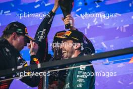 (L to R): Max Verstappen (NLD) Red Bull Racing celebrates his second position on the podium with third placed Fernando Alonso (ESP) Aston Martin F1 Team. 19.03.2023. Formula 1 World Championship, Rd 2, Saudi Arabian Grand Prix, Jeddah, Saudi Arabia, Race Day.
