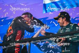 (L to R): Max Verstappen (NLD) Red Bull Racing celebrates his second position on the podium with third placed Fernando Alonso (ESP) Aston Martin F1 Team. 19.03.2023. Formula 1 World Championship, Rd 2, Saudi Arabian Grand Prix, Jeddah, Saudi Arabia, Race Day.
