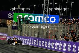 Race winner Sergio Perez (MEX) Red Bull Racing RB19 celebrates as he takes the chequered flag at the end of the race. 19.03.2023. Formula 1 World Championship, Rd 2, Saudi Arabian Grand Prix, Jeddah, Saudi Arabia, Race Day.
