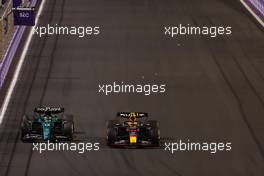 (L to R): Fernando Alonso (ESP) Aston Martin F1 Team AMR23 and Sergio Perez (MEX) Red Bull Racing RB19 battle for the lead of the race. 19.03.2023. Formula 1 World Championship, Rd 2, Saudi Arabian Grand Prix, Jeddah, Saudi Arabia, Race Day.