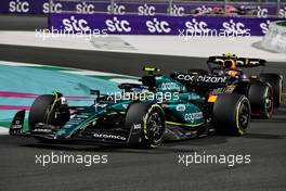 Fernando Alonso (ESP) Aston Martin F1 Team AMR23 leads Sergio Perez (MEX) Red Bull Racing RB19. 19.03.2023. Formula 1 World Championship, Rd 2, Saudi Arabian Grand Prix, Jeddah, Saudi Arabia, Race Day.