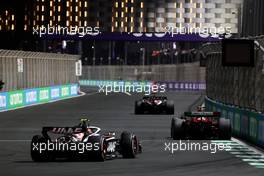 Zhou Guanyu (CHN) Alfa Romeo F1 Team C43 leads Nico Hulkenberg (GER) Haas VF-23. 19.03.2023. Formula 1 World Championship, Rd 2, Saudi Arabian Grand Prix, Jeddah, Saudi Arabia, Race Day.