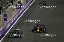 George Russell (GBR) Mercedes AMG F1 W14 leads Max Verstappen (NLD) Red Bull Racing RB19. 19.03.2023. Formula 1 World Championship, Rd 2, Saudi Arabian Grand Prix, Jeddah, Saudi Arabia, Race Day.