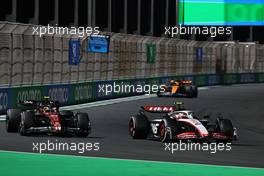 Kevin Magnussen (DEN) Haas VF-23 and Zhou Guanyu (CHN) Alfa Romeo F1 Team C43 battle for position. 19.03.2023. Formula 1 World Championship, Rd 2, Saudi Arabian Grand Prix, Jeddah, Saudi Arabia, Race Day.
