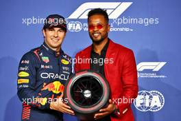 Sergio Perez (MEX) Red Bull Racing receives the Pirelli Pole Position Award from Patrice Evra (FRA) Former Football Player. 18.03.2023. Formula 1 World Championship, Rd 2, Saudi Arabian Grand Prix, Jeddah, Saudi Arabia, Qualifying Day.
