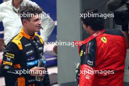 Lando Norris (GBR) McLaren with Carlos Sainz Jr (ESP) Ferrari. 17.09.2023. Formula 1 World Championship, Rd 16, Singapore Grand Prix, Marina Bay Street Circuit, Singapore, Race Day.