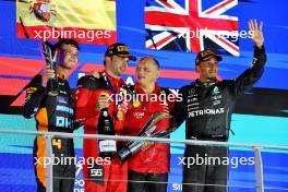 The podium (L to R): Lando Norris (GBR) McLaren, second; Carlos Sainz Jr (ESP) Ferrari, race winner; Frederic Vasseur (FRA) Ferrari Team Principal; Lewis Hamilton (GBR) Mercedes AMG F1, third. 17.09.2023. Formula 1 World Championship, Rd 16, Singapore Grand Prix, Marina Bay Street Circuit, Singapore, Race Day.