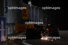 Sergio Perez (MEX) Red Bull Racing RB19 sends sparks flying. 16.09.2023. Formula 1 World Championship, Rd 16, Singapore Grand Prix, Marina Bay Street Circuit, Singapore, Qualifying Day.