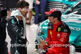 (L to R): Second placed George Russell (GBR) Mercedes AMG F1 with third placed Charles Leclerc (MON) Ferrari in qualifying parc ferme. 16.09.2023. Formula 1 World Championship, Rd 16, Singapore Grand Prix, Marina Bay Street Circuit, Singapore, Qualifying Day.